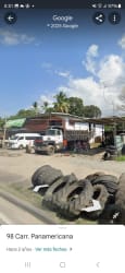 Open yard with utility buildings and truck access facing Panamericana Highway in Bejuco Panama