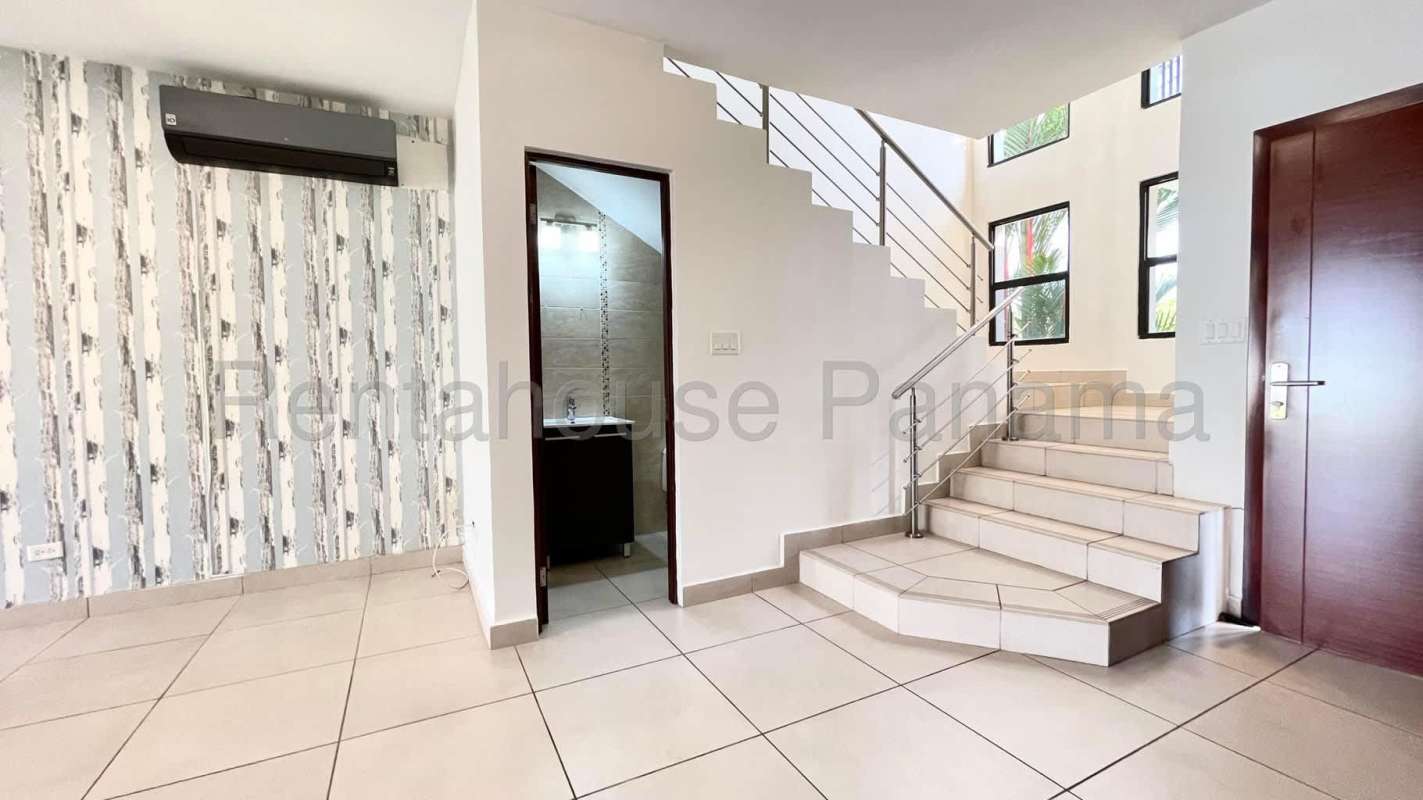 Kitchen area with granite countertops and wooden cabinets in Residencial Sierra Nevada Panama