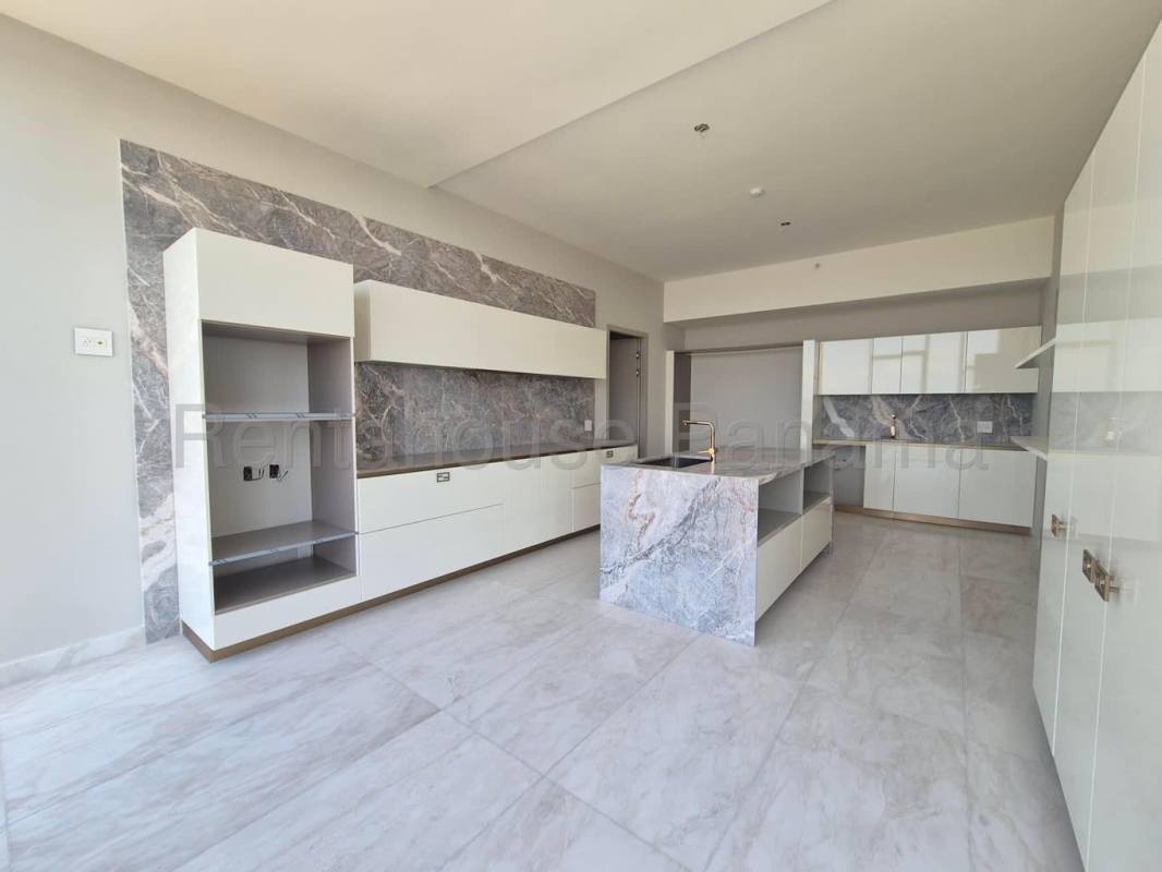 Designer kitchen with marble counters and island at PH La Maison Santa Maria Panama