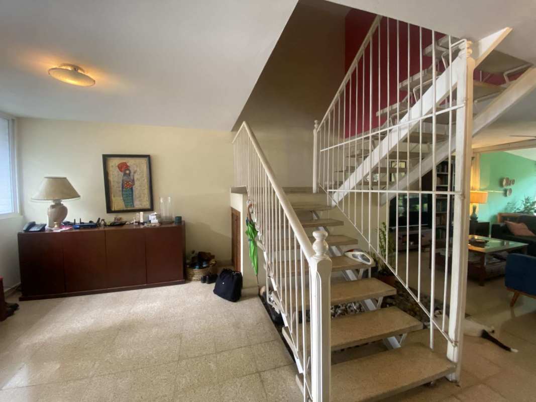 Dining area with access to large windows and kitchen at Via Transistmica