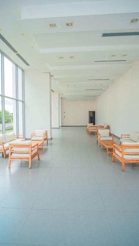 Modern gym with panoramic windows and equipment in PH Miradores Residence Panama City