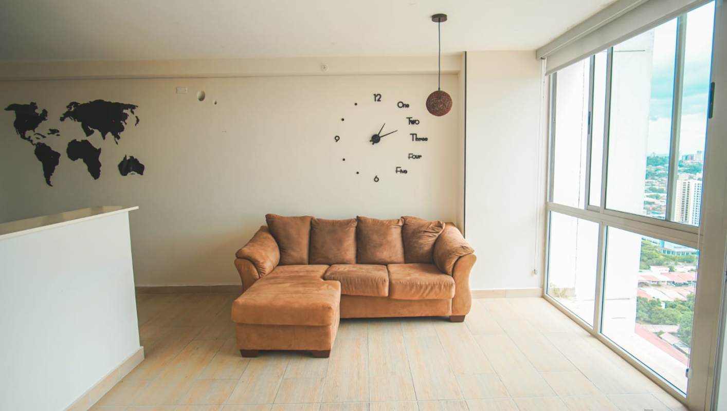 Living room with balcony panoramic city view in PH Miradores Residence Panama City apartment for rent