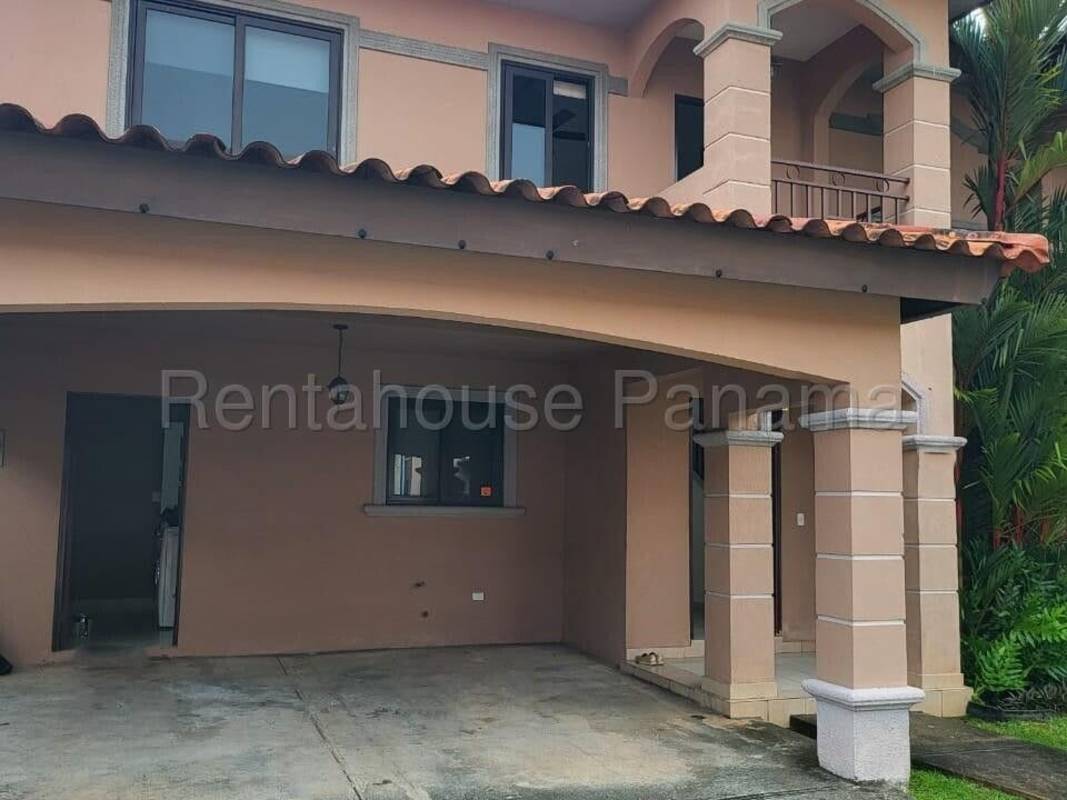 Exterior two-story Mediterranean villa with balcony and carport in Residencial Versalles Costa Sur Panama City