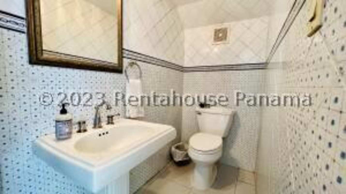 Remodeled kitchen with granite countertops wood cabinets stainless appliances in Altos del Golf Panama City