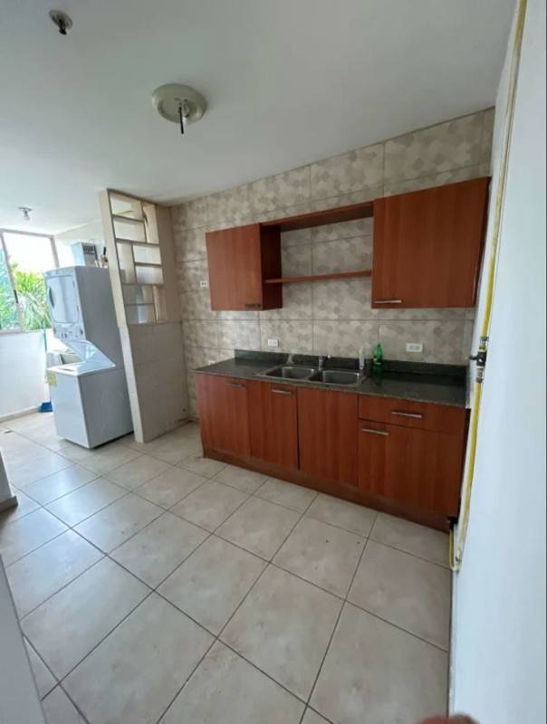 Contemporary kitchen with wood cabinets granite counters tiled backsplash PH Coco del Mar Panama