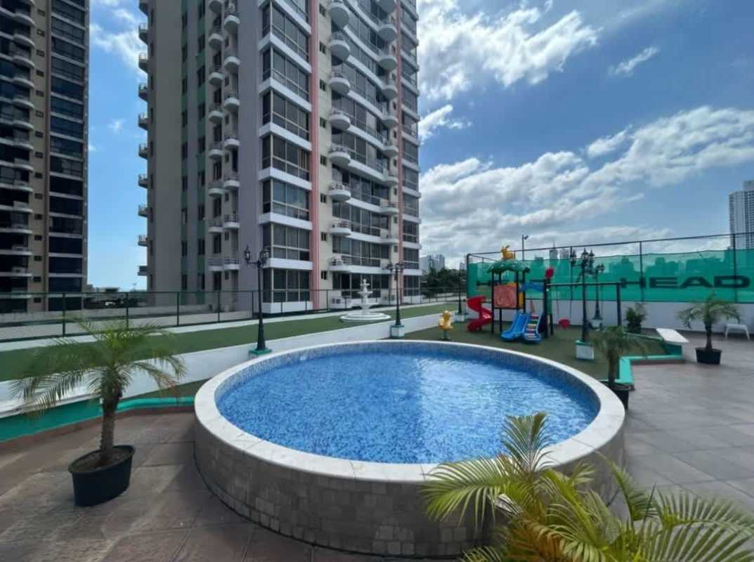 Apartment tower exterior round swimming pool children's playground PH Coco del Mar Panama