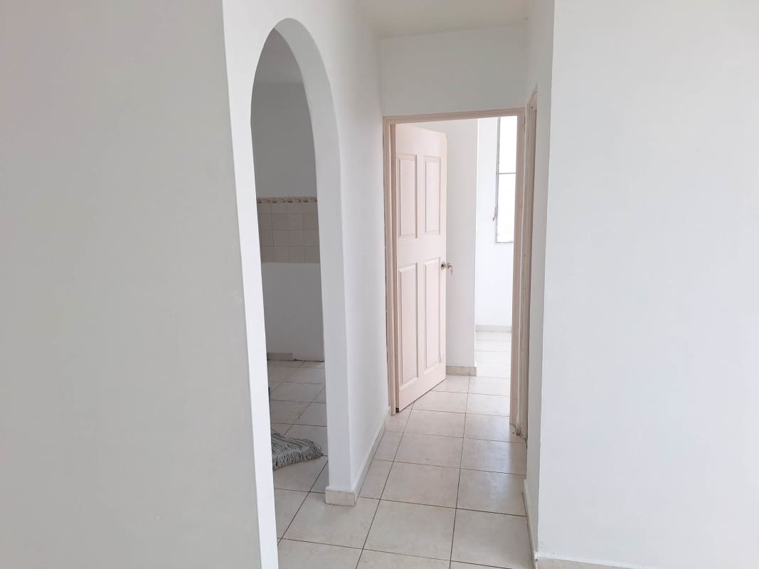 Minimalist hallway with ceramic tile bright space Panama City apartment rental San Miguelito