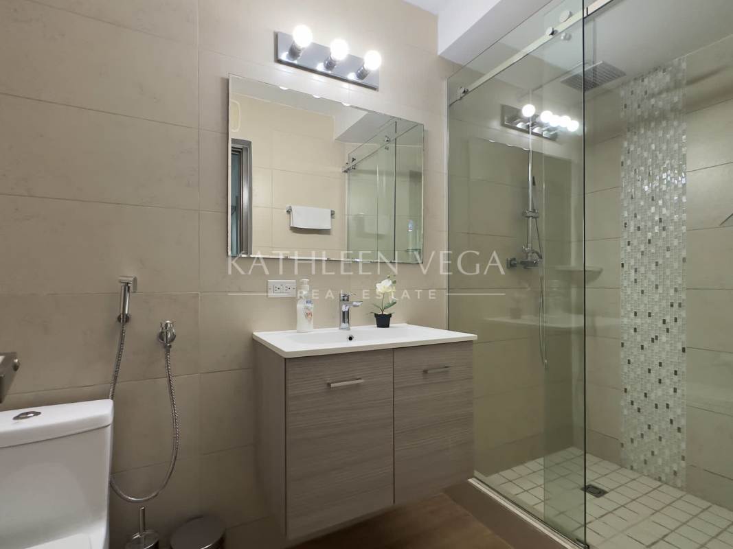 Semi-open kitchen with granite counters and stainless appliances PH Lumiere Costa del Este Panama