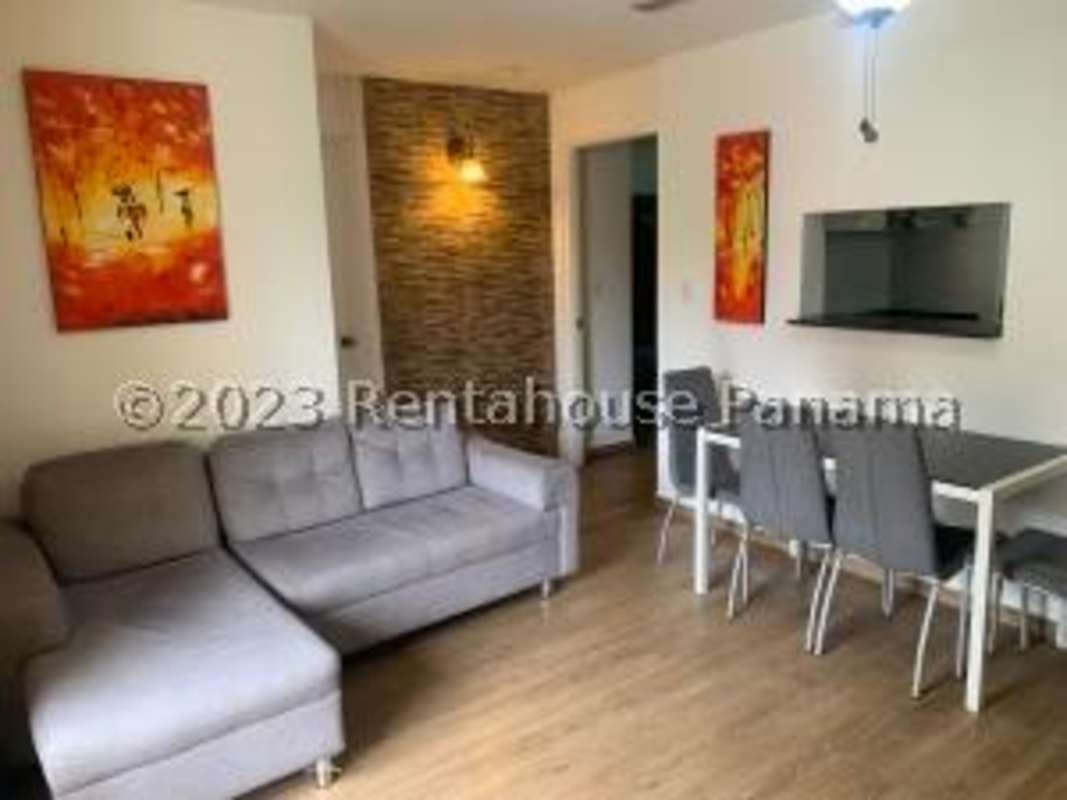 Bright living dining room space with ceramic floors and balcony in Condado del Rey Panama