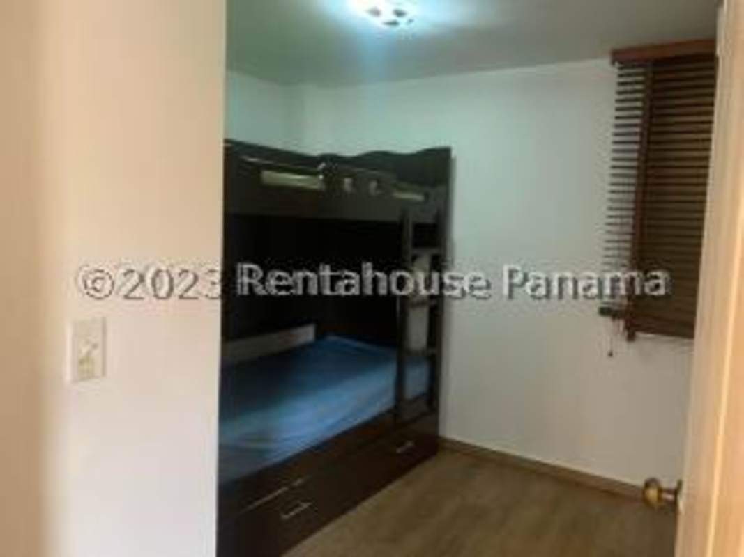 Compact kitchen with white cabinets and ceramic tiles Condado del Rey Panama