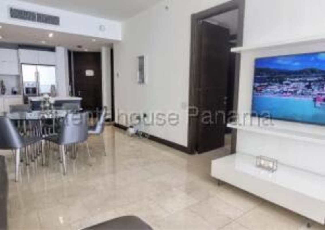 Contemporary kitchen in luxury apartment rental at JW Marriott with marble counters and stainless appliances