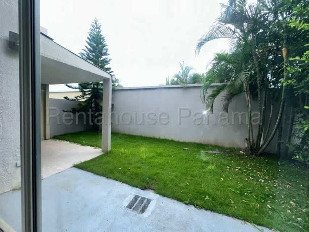 Bright living room with porcelain floors and sliding doors in Costa Village Panama