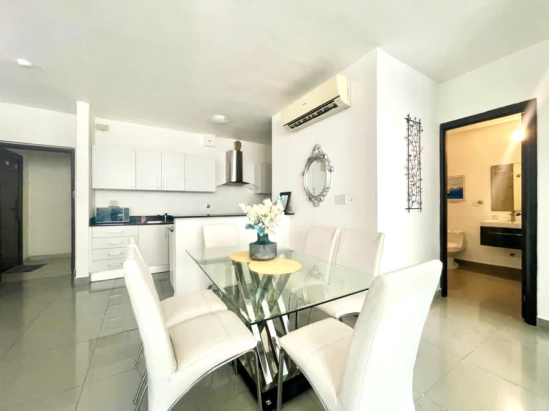 Bedroom featuring large window, closet, split AC at PH Quartier Panama City