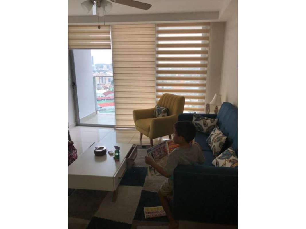 Living area with layered blinds, ceiling fan, balcony access in PH Torre de Castilla Panama City