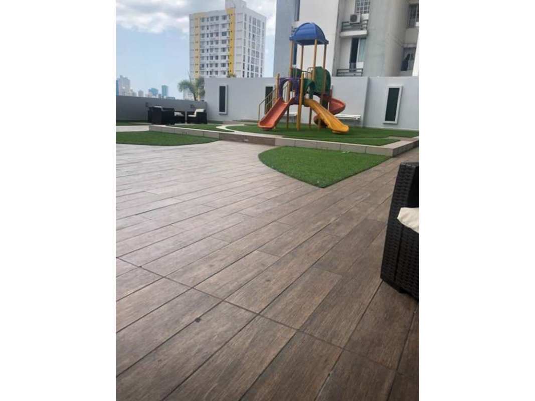 Bedroom with city night skyline view, queen bed, split AC and ceiling fan, PH Torre de Castilla Panama