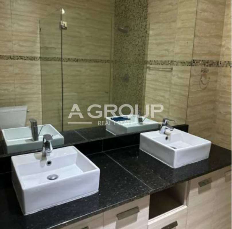 Elegant bathroom with walk-in glass shower and mosaic accents Punta Pacifica Panama