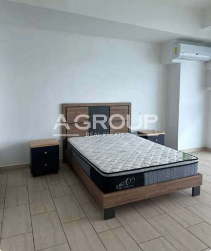 Luxurious modern living room with floor-to-ceiling windows and ocean skyline views in PH Grand Tower Panama City