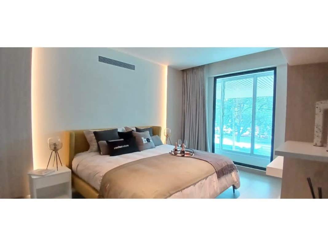 Modern living area and kitchen with island in Uptown Bellavista Panama