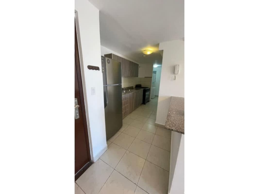 Granite countertop, stove, refrigerator, tile floor in kitchen PH Vista Marina Panama City