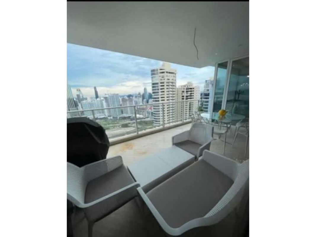 Expansive private balcony with glass railing overlooking ocean and city at PH Peninsula Punta Paitilla