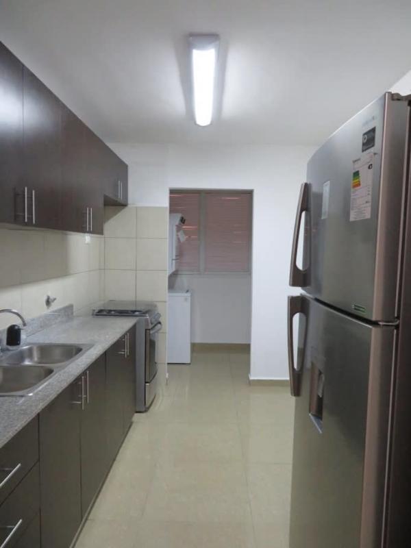 Modern kitchen with granite countertop, appliances at PH Urbis Tower Ricardo Alfaro Panama