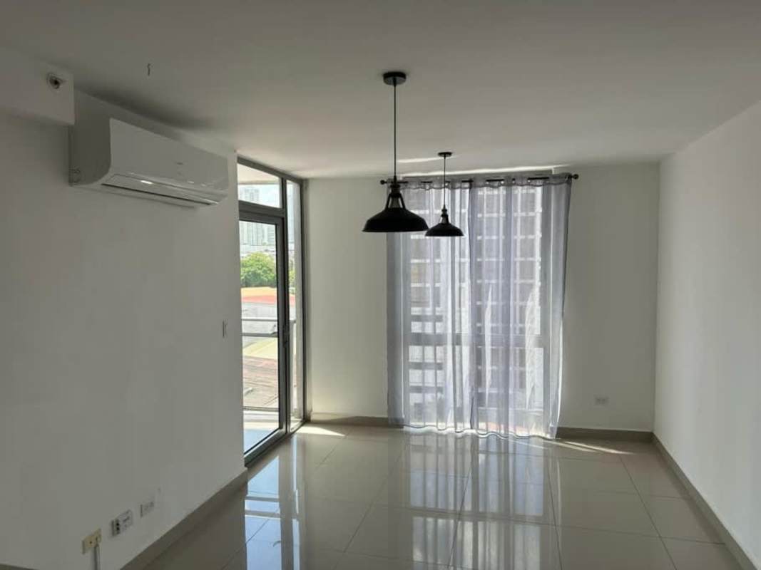 Kitchen with laundry appliances, tile floor and pendant lighting PH Luma Tower Panama