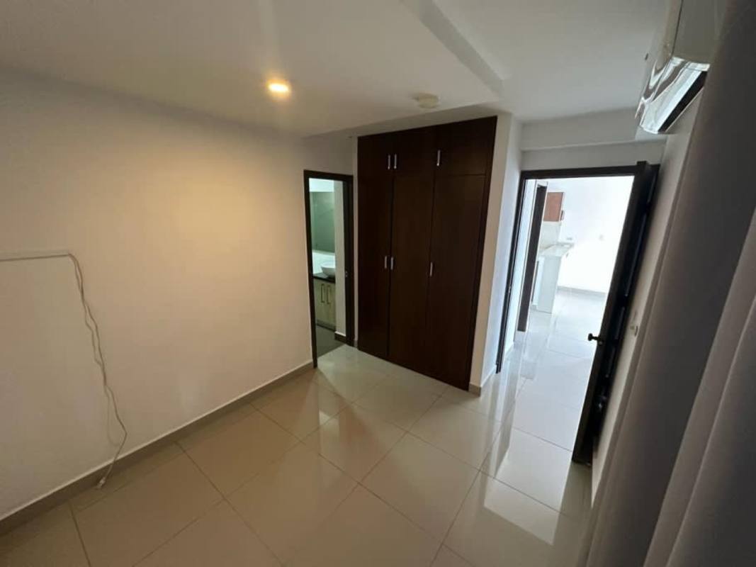 Unfurnished bedroom with built-in closet and tiled floor in PH Luma Tower Panama