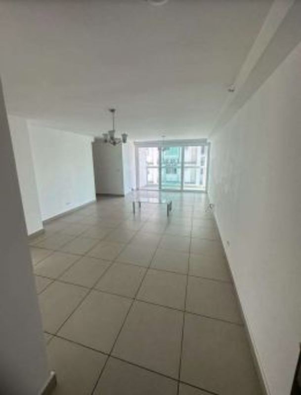 Bright living room with tiled floors and balcony access at PH King's Park Condado del Rey Panama City