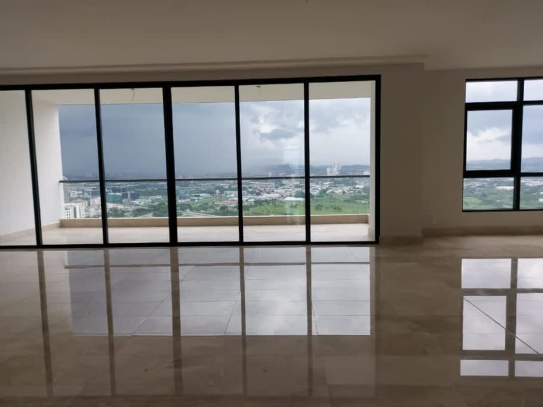 Minimalist living space with sliding glass doors to balcony, panoramic city views, marble floor
