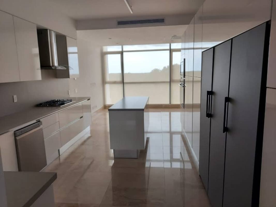 Luxury kitchen featuring island, built-in appliances, large windows with view Santa Maria Golf Panama
