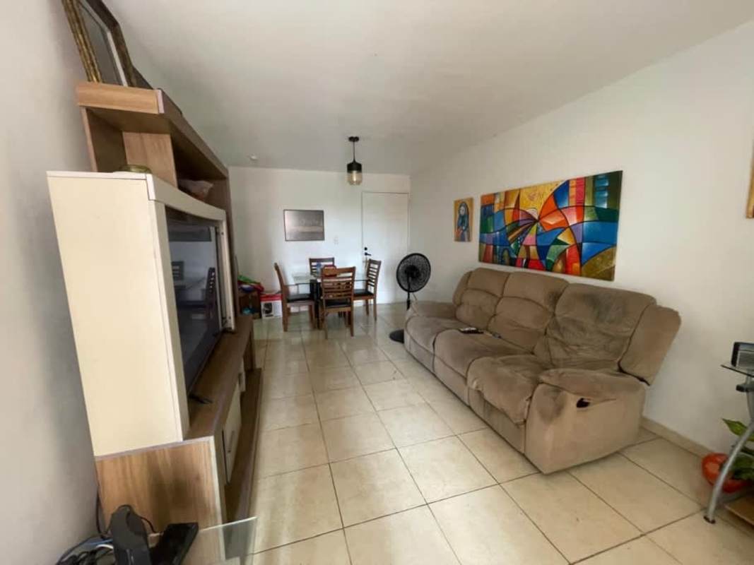 Open concept dining and living room with neutral tiles and balcony in PH Royal Hills Panama City