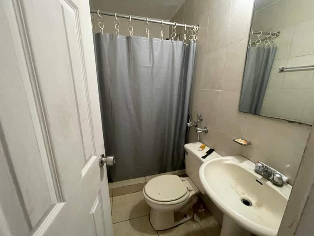 Corridor with twin elevators and entry doors in PH Royal Hills Tower II Panama