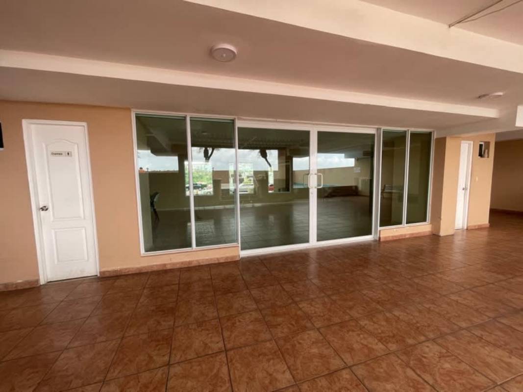 Condo building lobby with glass sliding doors tiled floors in PH Royal Hills Tower II Betania Panama