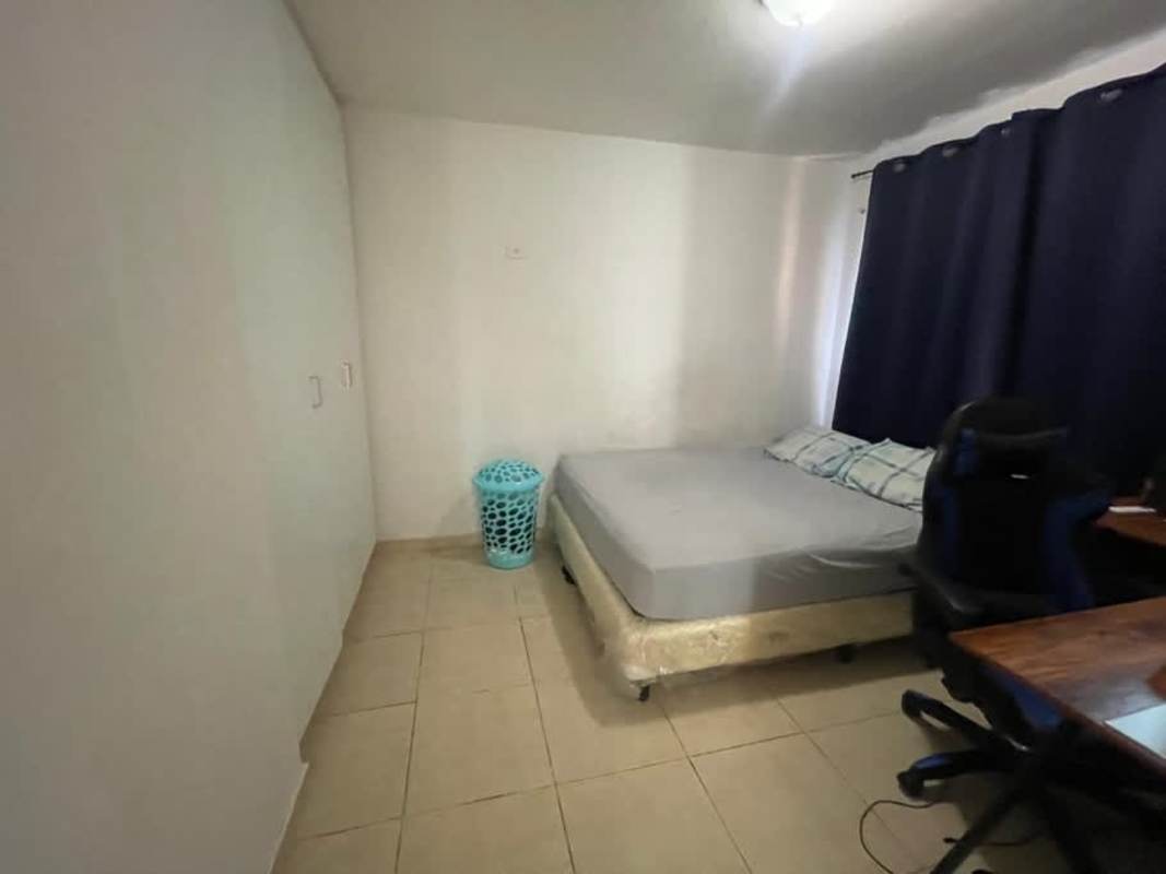 Simple bedroom with large wardrobe and window in PH Royal Hills Villa de las Fuentes I Panama City