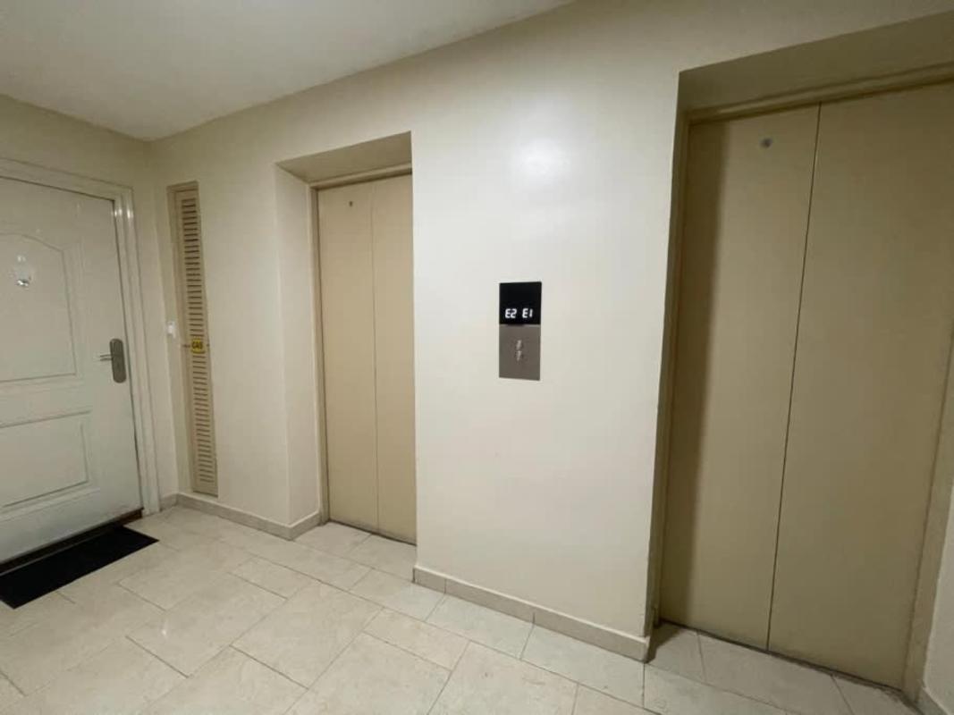 Two elevators in secured residential hallway PH Royal Hills Tower II Panama City