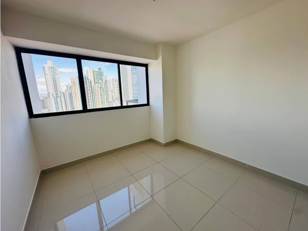 Empty bedroom with large window overlooking Panama City skyline in PH Balboa Bay Avenida Balboa Panama