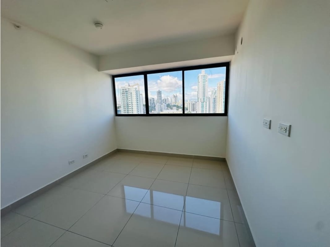 Bright master bedroom with floor-to-ceiling windows offering city and bay views PH Balboa Bay Avenida Balboa Panama