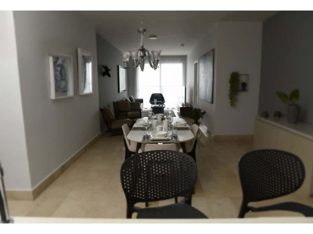 Dining and living area with natural light and ocean views at Yoo Panama