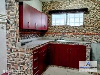 Closeup kitchen mosaic backsplash mahogany cabinetry rental house David Panama