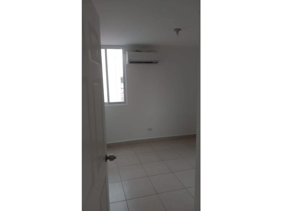 Tile-walled bathroom with shower and toilet in Residencial Las Palmeras Panama City