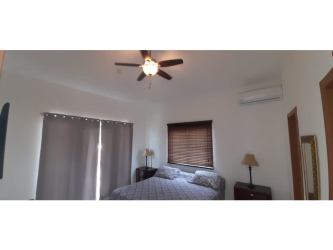 Bedroom with split AC, balcony and ensuite bathroom beach house Playa Malibu Nueva Gorgona Panama