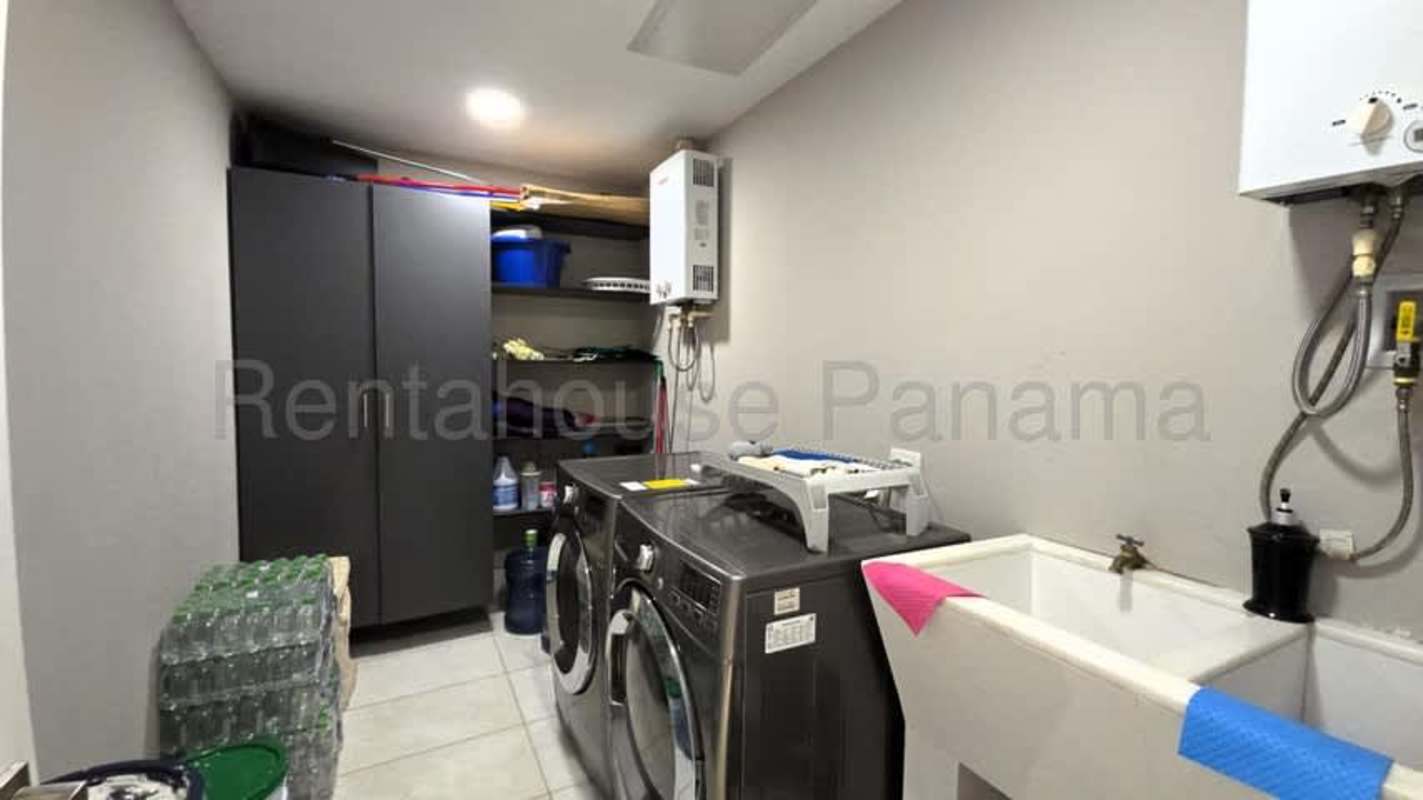 Bathroom with marble walls, glass walk-in shower, and luxury fixtures at The Residences Panama