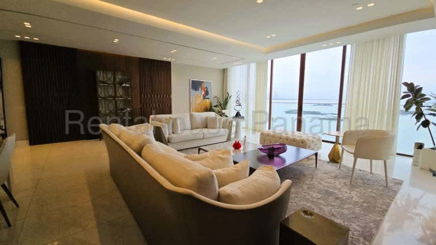 Luxury furnished apartment kitchen with marble floors and granite island at The Residences in Punta Pacífica Panama City