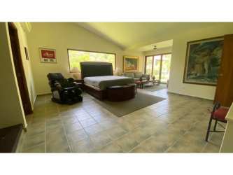 Master bedroom vaulted ceiling, large windows pool view Coronado Golf Estate