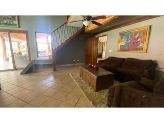 Elegant foyer with high ceilings, wood accents, balcony overlook Coronado Panama