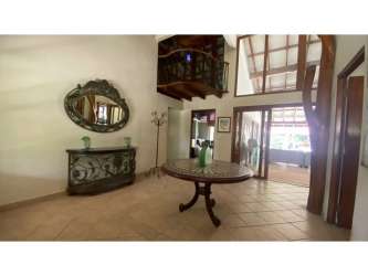 Single story ranch home with tiled roof and porch in Coronado Golf community Panama