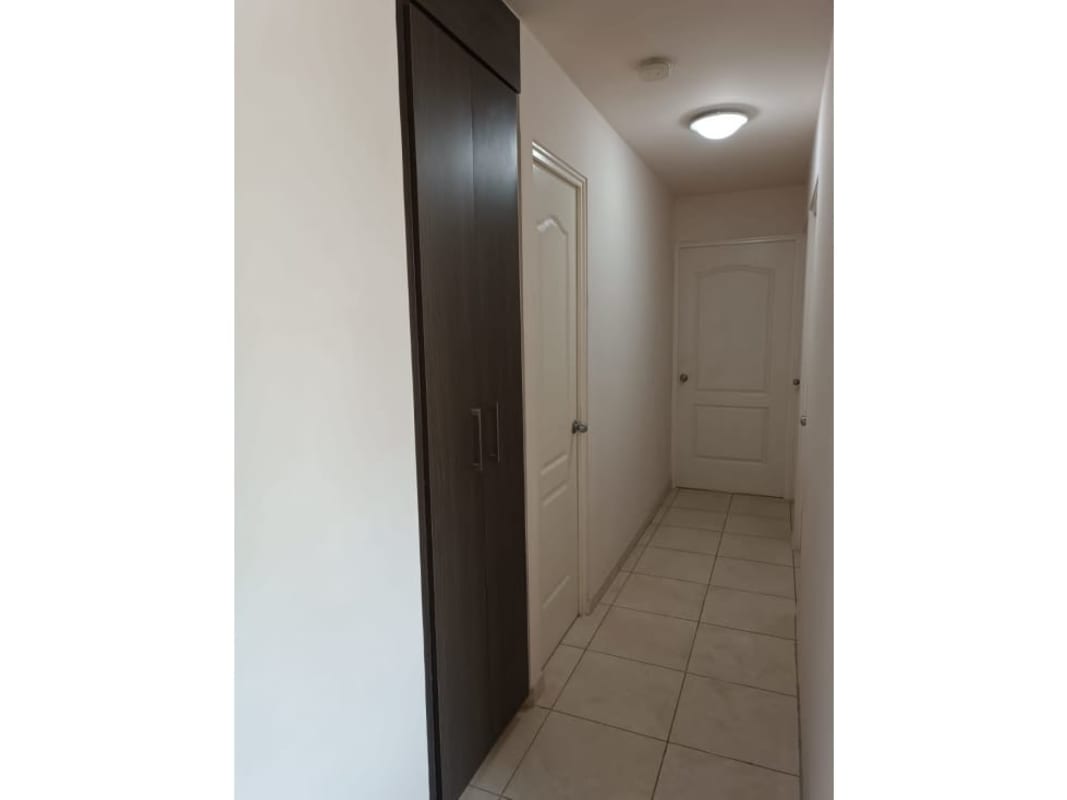 Hallway with ceramic tile floor and built-in storage closet in PH Mallorca Park Los Andes Panama