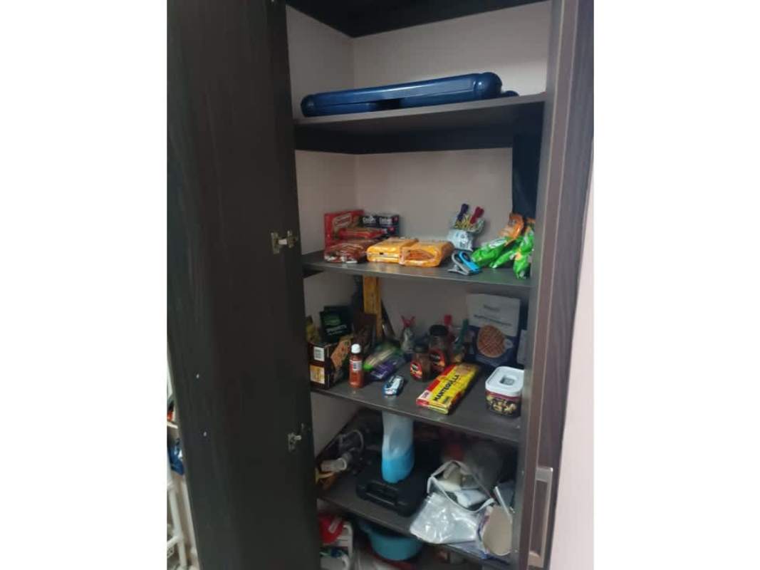 Modern L-shaped kitchen with granite countertops and wood cabinetry PH Mallorca Park Los Andes