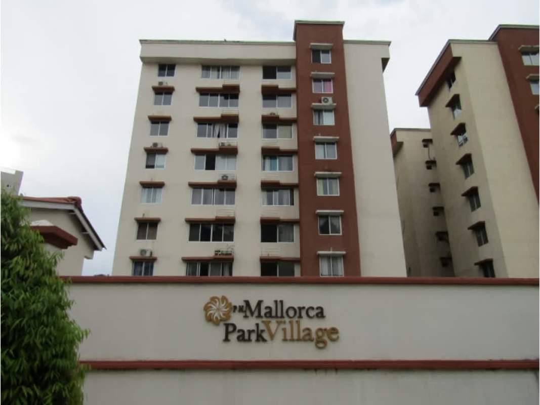 Multi-story residential tower Mallorca Park Village with signage in Los Andes Panama City