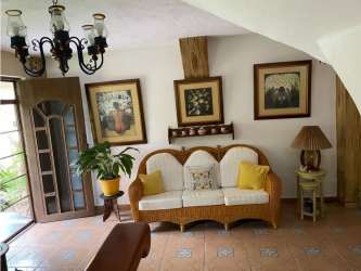 Mediterranean style living room with wooden beams, ceramic tile floors, open space in Coronado Golf Resort